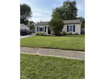 Charming home featuring a well-manicured lawn and welcoming curb appeal with a tidy landscape at 174 Jordan Dr, Franklin, IN 46131