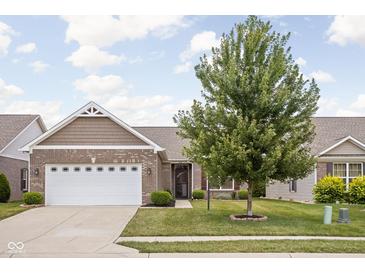 Charming home with a well-maintained lawn and attractive landscaping at 1418 Blackthorne S Trl, Plainfield, IN 46168