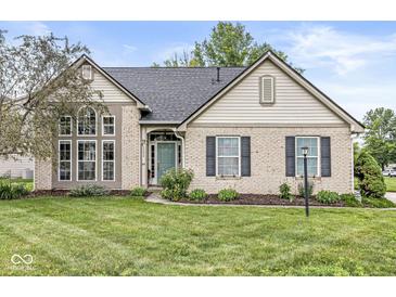 Charming single-Gathering home with a brick facade, manicured lawn, and a welcoming front entrance at 5299 Breakers Way, Carmel, IN 46033