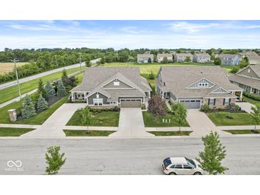 Beautiful single-Gathering home featuring a well-maintained lawn, mature trees, and an attached two-car garage at 10814 Matherly Way, Noblesville, IN 46060