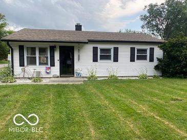 Charming one-story home with a well-manicured lawn and inviting curb appeal at 2650 Woodrow Ave, Indianapolis, IN 46241
