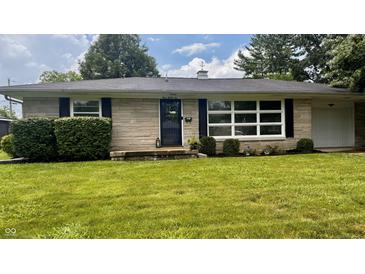 Charming single-story home with stone facade, manicured lawn, and mature landscaping at 336 Brookside Ln, Plainfield, IN 46168