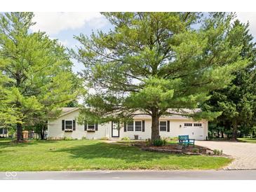 Traditional home exterior with tidy landscaping, mature shade trees, and great curb appeal at 6429 Walnut Way, Brownsburg, IN 46112