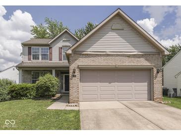 Charming two-story home with a brick facade and attached two-car garage at 1225 Berrywood Dr, Greenwood, IN 46143