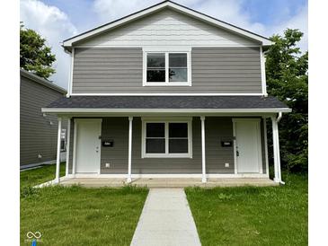 Charming two-story duplex with gray siding, white trim and inviting front porches at 420 S Hamilton Ave, Indianapolis, IN 46201