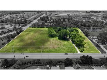 Areal shot of a large parcel of land ready for development with nearby subdivisions and pond in a desirable location at 6637 E County Road 600 S, Plainfield, IN 46168
