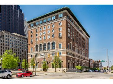 Spacious brick building with green roof trim against a bright blue sky on a sunny day at 350 N Meridian St # 606/607, Indianapolis, IN 46204