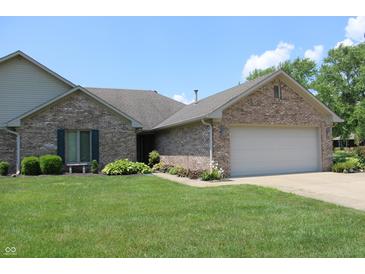Charming single-story home featuring a brick facade, well-manicured lawn, and an attached two-car garage at 126 Old Farm Rd, Danville, IN 46122