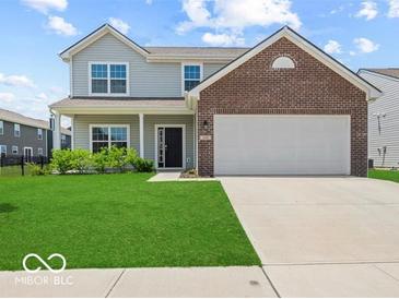 Charming two-story home with a well-maintained lawn and a two-car garage at 1456 Willow Tree Ln, Sheridan, IN 46069
