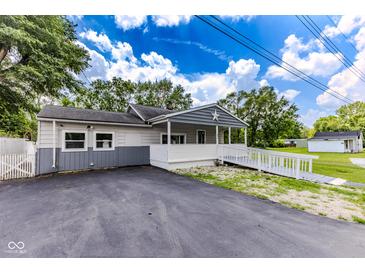 Charming single-story home with a welcoming front porch and accessibility ramp at 1511 E 20Th St, Muncie, IN 47302