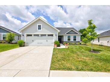Charming one-story home with a well-manicured lawn, concrete driveway, and attached two-car garage at 2500 Sand Hollow Dr, Lebanon, IN 46052