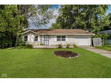 Charming single-story home with a well-manicured lawn and inviting curb appeal at 2807 Carla Ct, Indianapolis, IN 46219