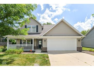 Charming two-story home with a welcoming front porch and attached two-car garage at 3067 Stilton Dr, Cicero, IN 46034
