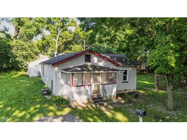 Charming home featuring a cozy screened porch and freshly mowed lawn at 637 Olin Ave, Indianapolis, IN 46222