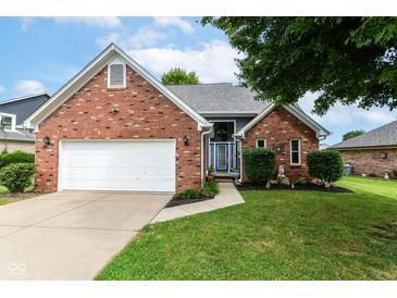 Beautiful single-story brick home with well-manicured lawn and two-car garage at 662 Leah Way, Greenwood, IN 46142