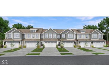 Charming townhome exteriors with gray siding, white trim, and well-manicured front lawns at 7693 Marin Pkwy, Cumberland, IN 46229