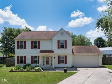 Charming two-story home features red shutters, manicured lawn and attached two car garage at 901 Mallory Pkwy, Franklin, IN 46131