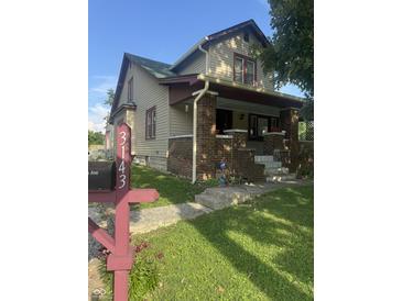 Attractive home exterior with well maintained lawn, classic design elements, and good neighborhood setting at 3143 Carson Ave, Indianapolis, IN 46227
