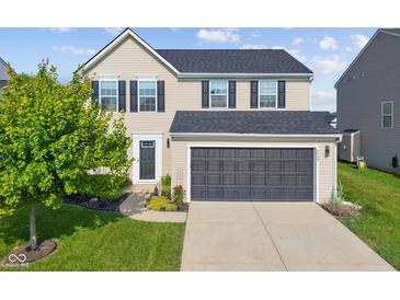 Charming two-story home with a two-car garage and manicured front lawn at 3230 Hemlock St, Whiteland, IN 46184