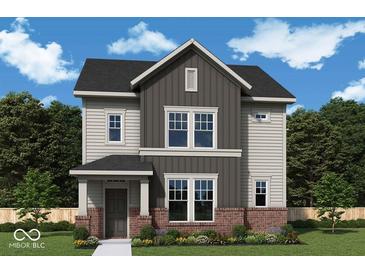 Charming two-story home showcasing neutral siding, black roof, red brick accents, and landscaped front yard at 11998 Vera Ct, Noblesville, IN 46060
