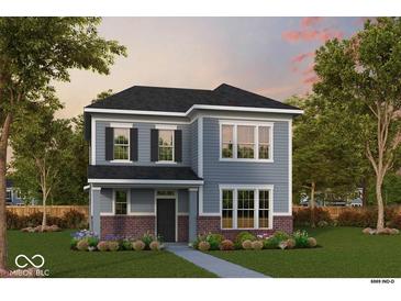 Charming two-story home with blue siding, brick accents, manicured lawn, and inviting landscape at 12222 Vera Ct, Noblesville, IN 46060
