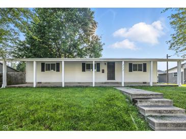 Well-maintained home featuring a classic design, front lawn, and inviting curb appeal at 212 N 13Th St, Elwood, IN 46036