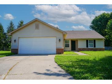 Charming ranch-style home with an attached two-car garage and well-manicured lawn at 6029 Sycamore Forge Dr, Indianapolis, IN 46254