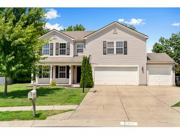 Charming two-story home with a well-manicured lawn, two-car garage, and a basketball hoop in the driveway at 3058 Mcintosh Dr, Bargersville, IN 46106