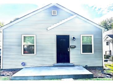 Charming home featuring horizontal siding and a black front door at 3508 Brouse Ave, Indianapolis, IN 46218