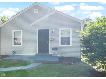 Charming single-story home with gray siding, a dark front door, and freshly cut lawn at 3508 Brouse Ave, Indianapolis, IN 46218