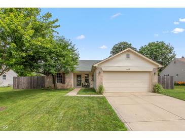 Charming single-story home with a two-car garage and well-manicured lawn at 59 Millet Ct, Danville, IN 46122