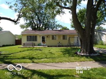 Charming single-story home with mature trees and a well-maintained lawn, perfect for outdoor enjoyment at 3213 S Cherokee Rd, Muncie, IN 47302