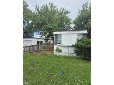 Exterior of a mobile home featuring a ramp and deck at 3216 Memorial N Dr, Elwood, IN 46036
