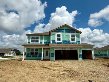 View of a two-story home under construction, showcasing the exterior design and garage at 6016 Granby Dr, Whitestown, IN 46075