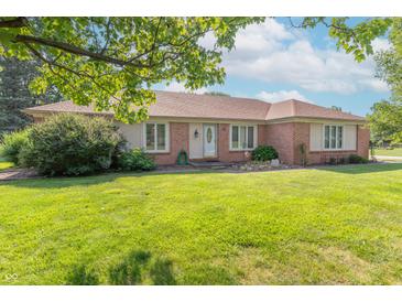 Charming brick home featuring a well-manicured lawn, bright windows, and a welcoming front entrance at 425 Saddle Hill Ct, Indianapolis, IN 46234