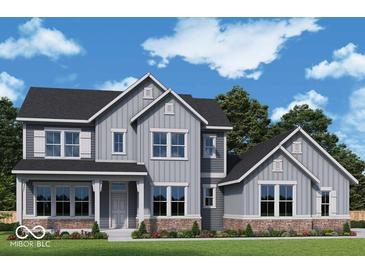 Charming two-story home showcasing gray siding, black roof and complemented by professionally landscaped yard at 19614 Wood Farm Pl, Westfield, IN 46074