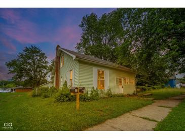 Charming home showcasing lush greenery and a well-maintained front yard at 2627 Chase St, Anderson, IN 46016