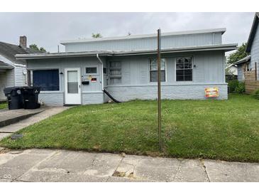Charming single-story home featuring a cozy front yard, light blue siding and white trim at 2731 Delaware St, Anderson, IN 46016
