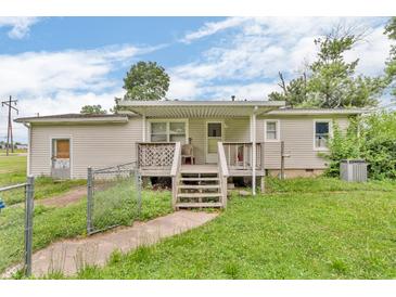 Charming one-story home with a covered porch and well-maintained front lawn at 6349 S Harding St, Indianapolis, IN 46217