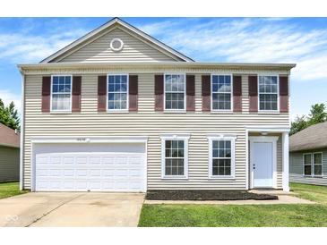Charming two-story home with red shutters, large garage, and well-maintained lawn at 10658 Pavilion Dr, Indianapolis, IN 46259