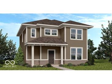 Charming two-story home with tan siding, white trim, covered porch, and well-manicured landscaping at 9124 Anthem Ave, Plainfield, IN 46168