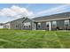 Green grass yard with dark siding on a house and gray roof at 16969 Cole Evans Dr, Noblesville, IN 46060