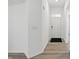 Entryway with neutral paint, wood floors, a white door, and black door mat at 16969 Cole Evans Dr, Noblesville, IN 46060