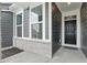 This home features a black front door, well placed windows, stone accents, and house numbers at 16969 Cole Evans Dr, Noblesville, IN 46060