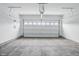 Spacious two car garage with concrete floor and white walls at 16969 Cole Evans Dr, Noblesville, IN 46060