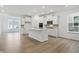 Bright kitchen with recessed lighting, stainless appliances, white cabinets, hardwood floors and a kitchen island at 16969 Cole Evans Dr, Noblesville, IN 46060