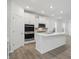 Modern kitchen featuring stainless steel appliances, white cabinets, and an island at 16969 Cole Evans Dr, Noblesville, IN 46060