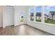 Sun-filled living room with large windows and backyard views at 16969 Cole Evans Dr, Noblesville, IN 46060