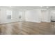 This open living space features hardwood floors, neutral paint, several windows, and recessed lighting at 16969 Cole Evans Dr, Noblesville, IN 46060