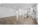 Open living space and kitchen featuring hardwood floors, neutral paint, and recessed lighting at 16969 Cole Evans Dr, Noblesville, IN 46060
